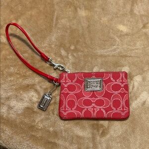 Coach Signature Red Wristlet with silver accents.